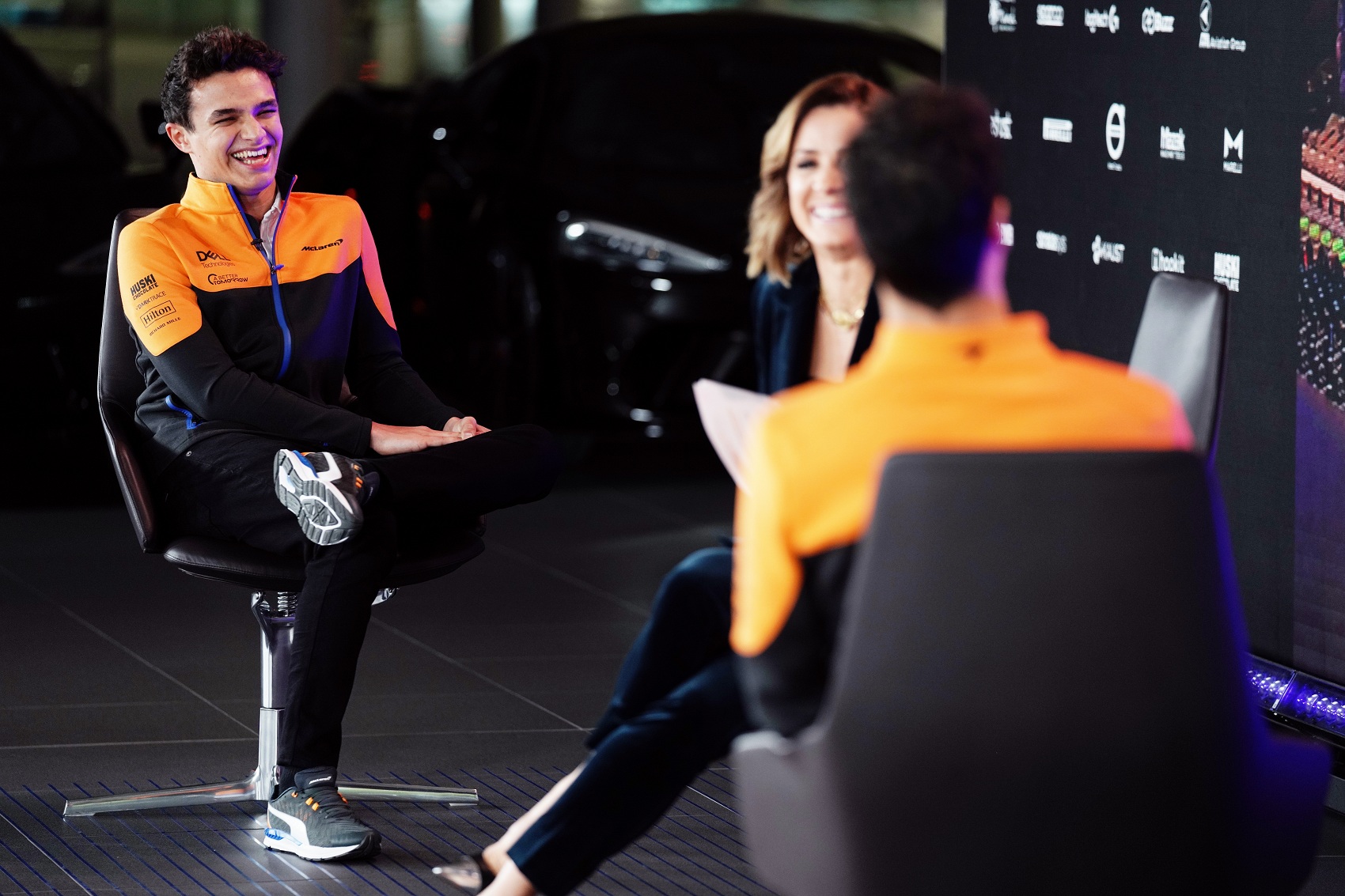 Lando Norris, Natalie Pinkham, Daniel Ricciardo