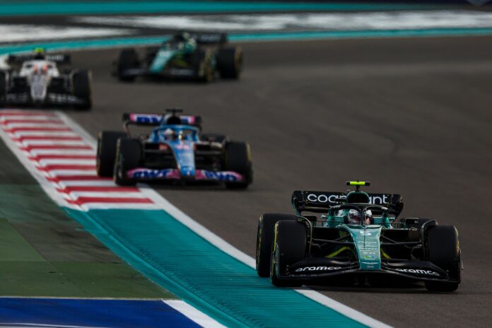 Sebastian Vettel, Aston Martin AMR22, leads Fernando Alonso, Alpine A522