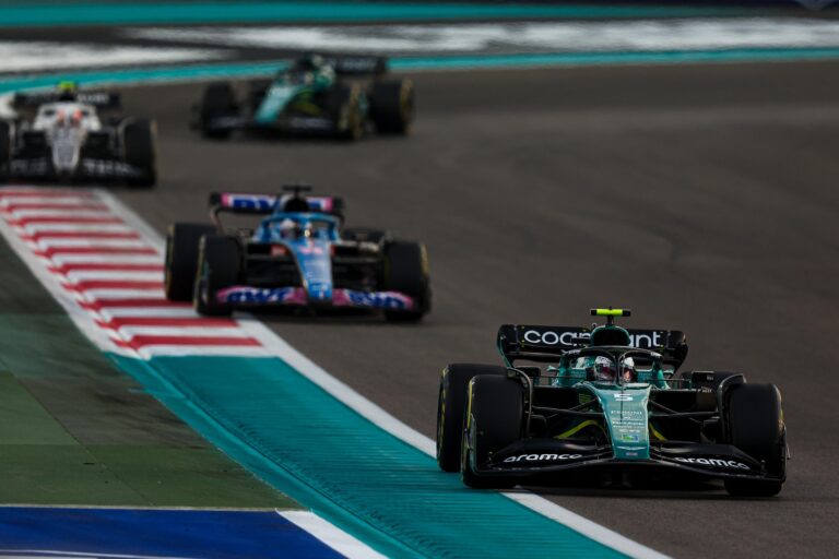 Sebastian Vettel, Aston Martin AMR22, leads Fernando Alonso, Alpine A522