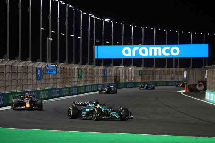 Fernando Alonso, Aston Martin AMR23, leads Sergio Perez, Red Bull Racing RB19